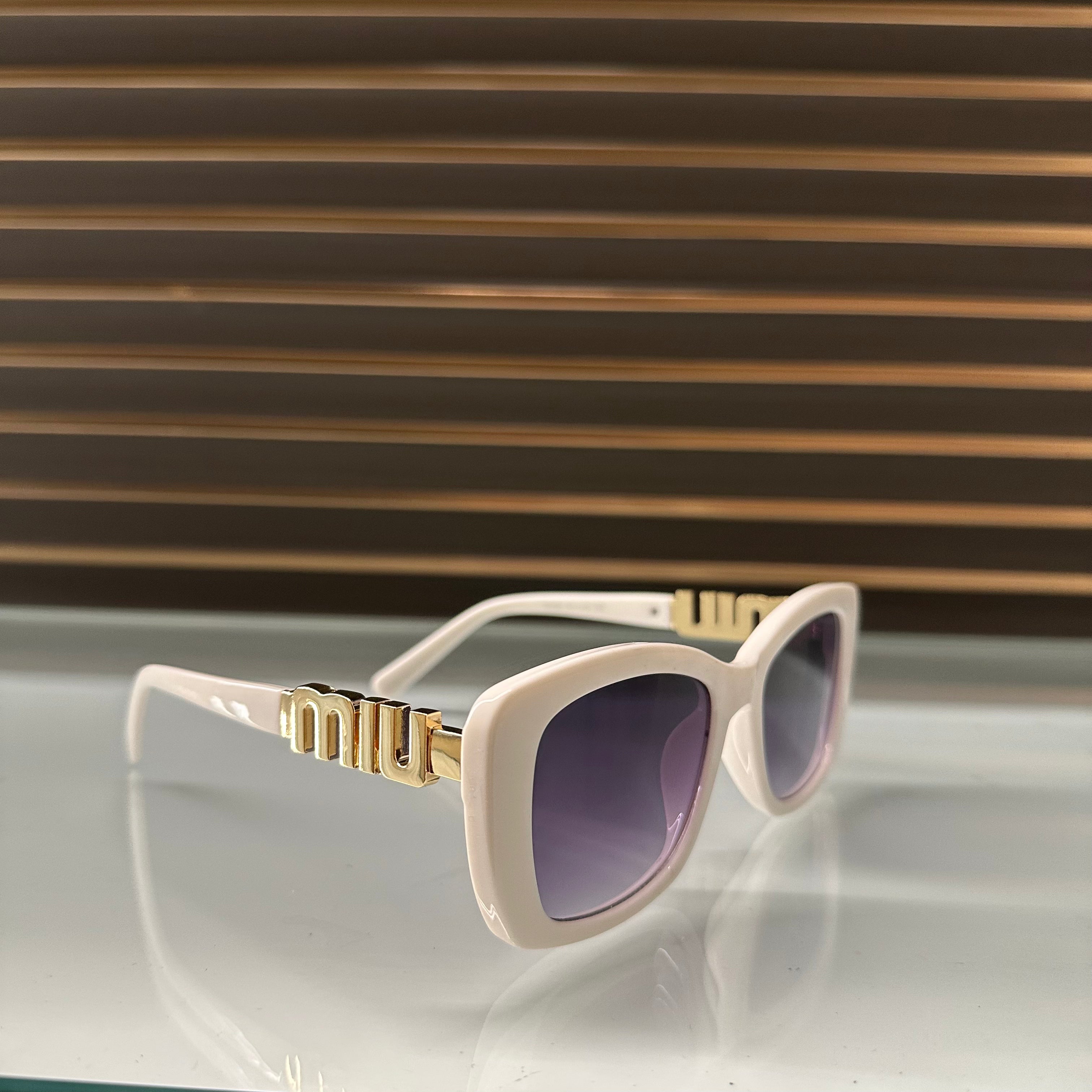 Miu Miu 26321 Sunglasses β White & Black Frames with Dark Grey or Black Lenses