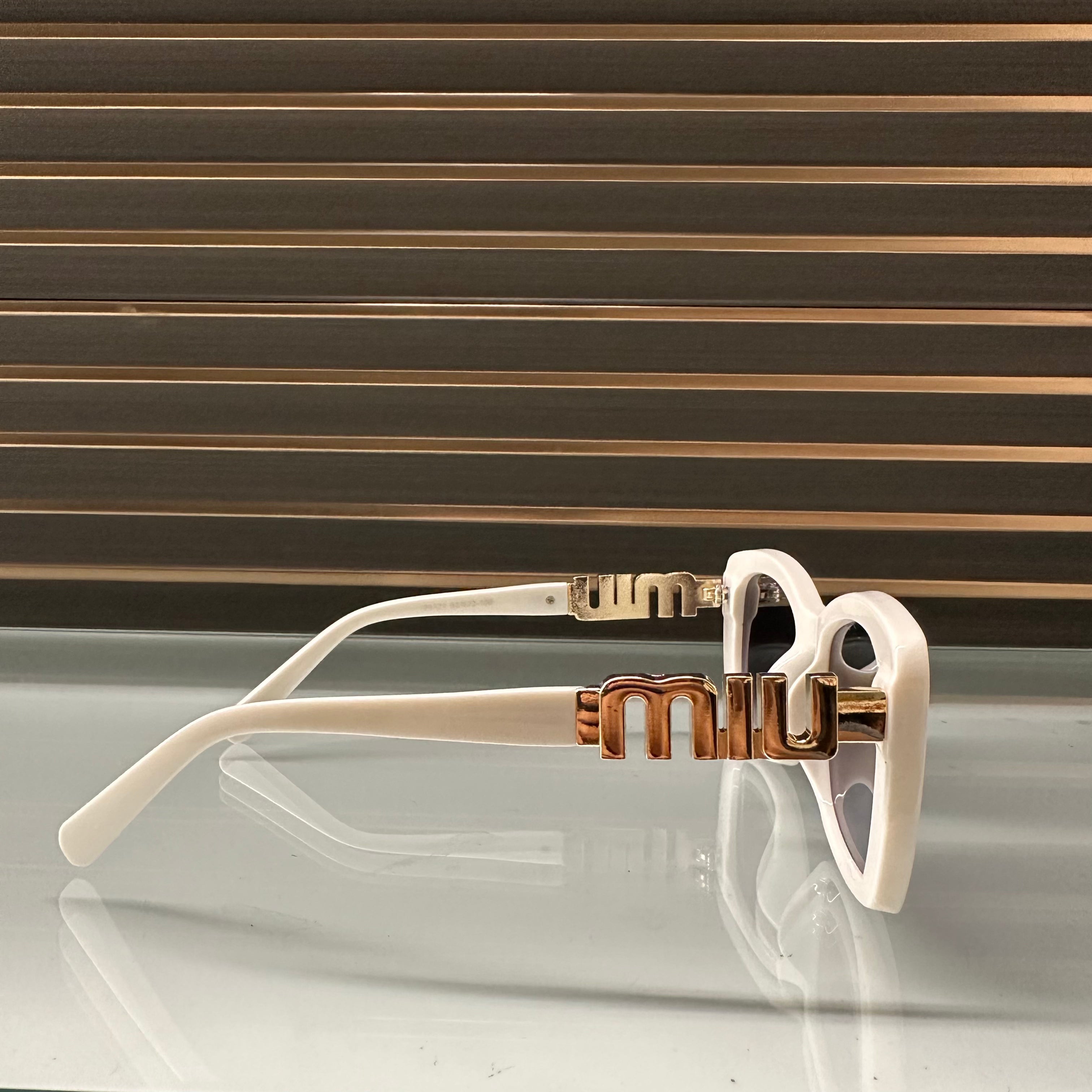 Miu Miu 26321 Sunglasses β White & Black Frames with Dark Grey or Black Lenses