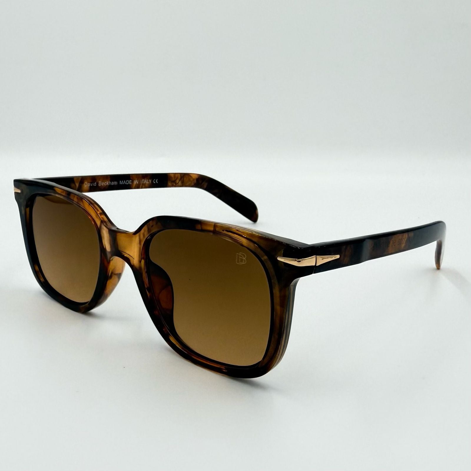 David Beckham UM2002 Square Sunglasses ā Black & Brown Frames with Orange or Blue Lenses