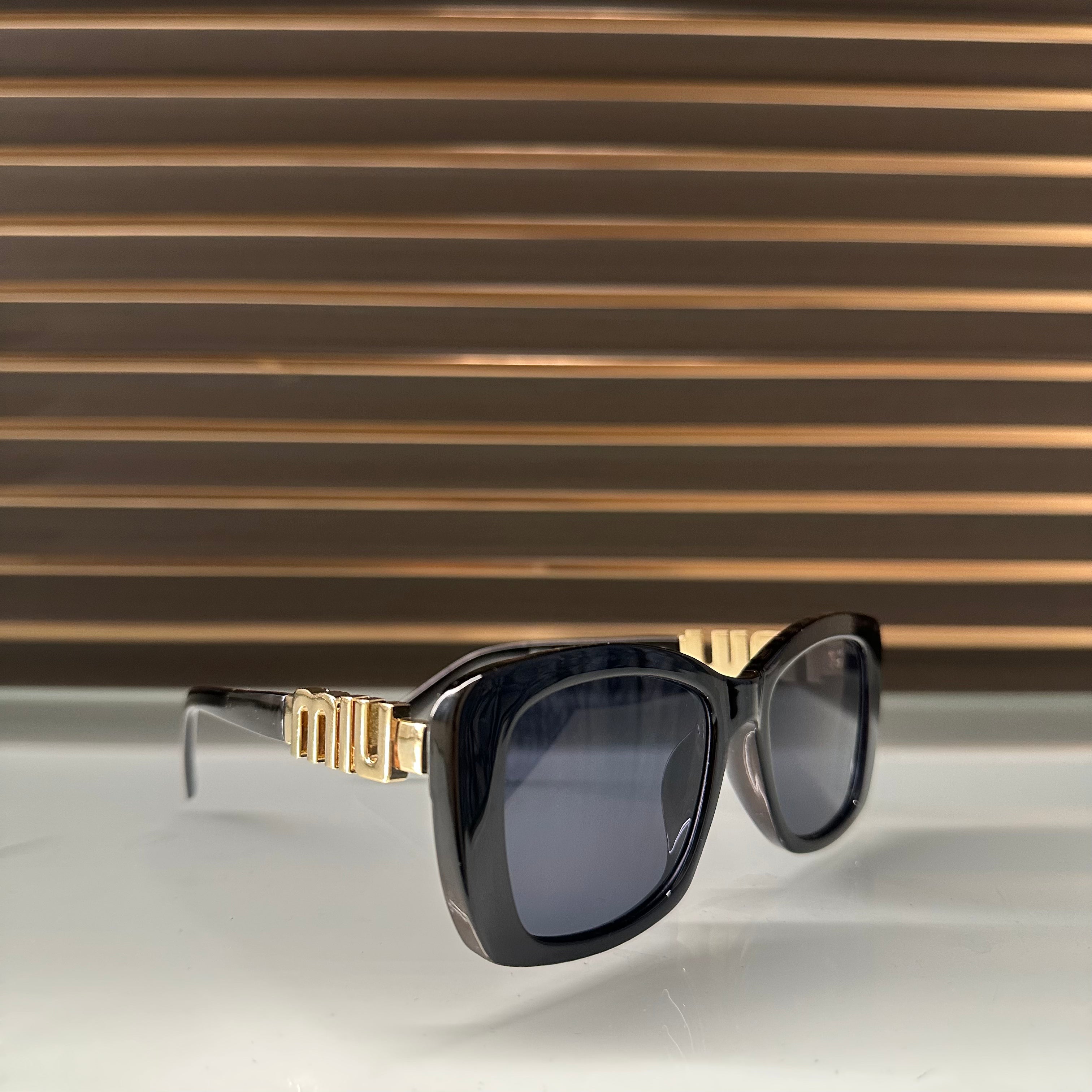 Miu Miu 26321 Sunglasses – White & Black Frames with Dark Grey or Black Lenses